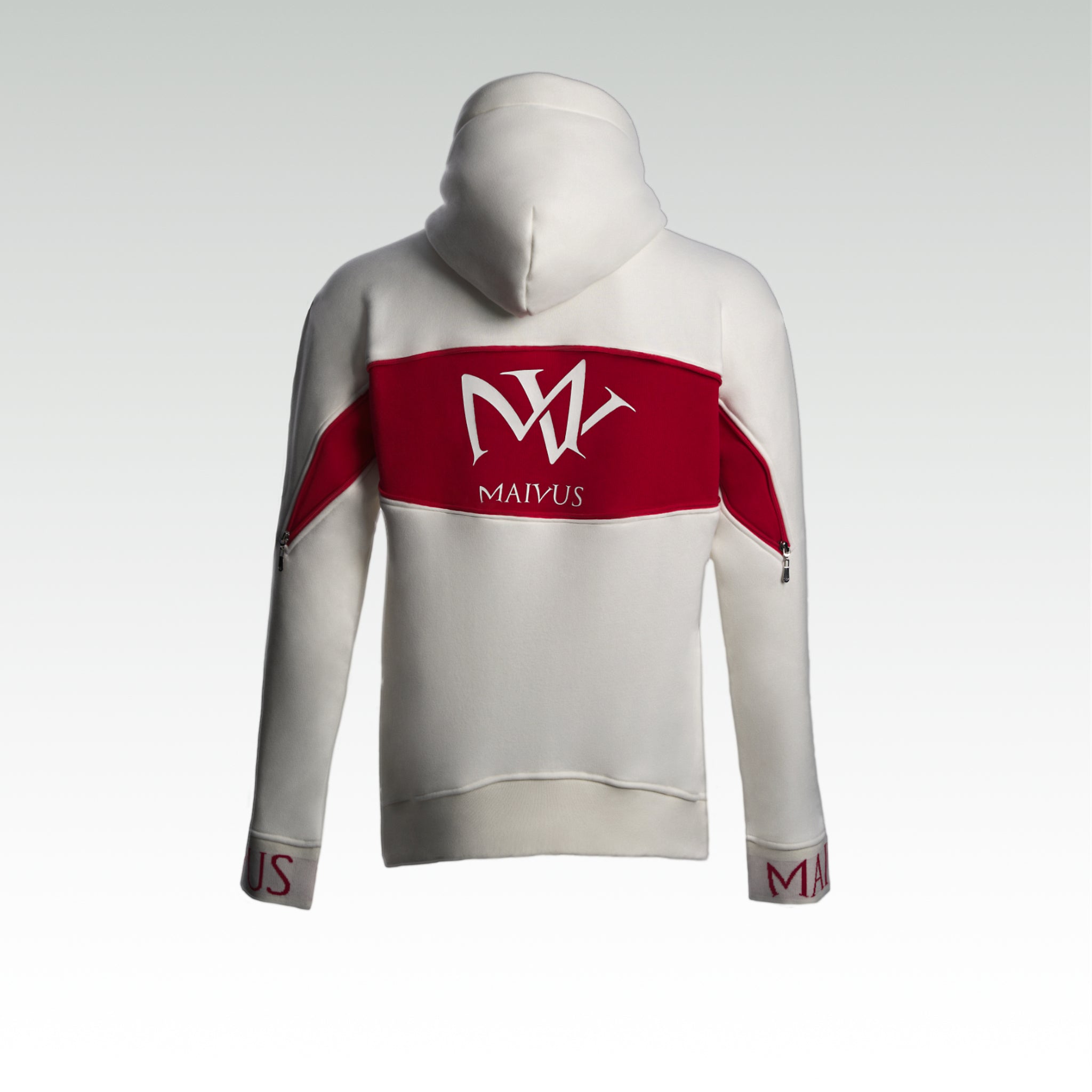 Close up pf a white and red luxury hoodie. Large 'MV' logo on back of hoodie from 'MAIVUS' against a white studio backdrop