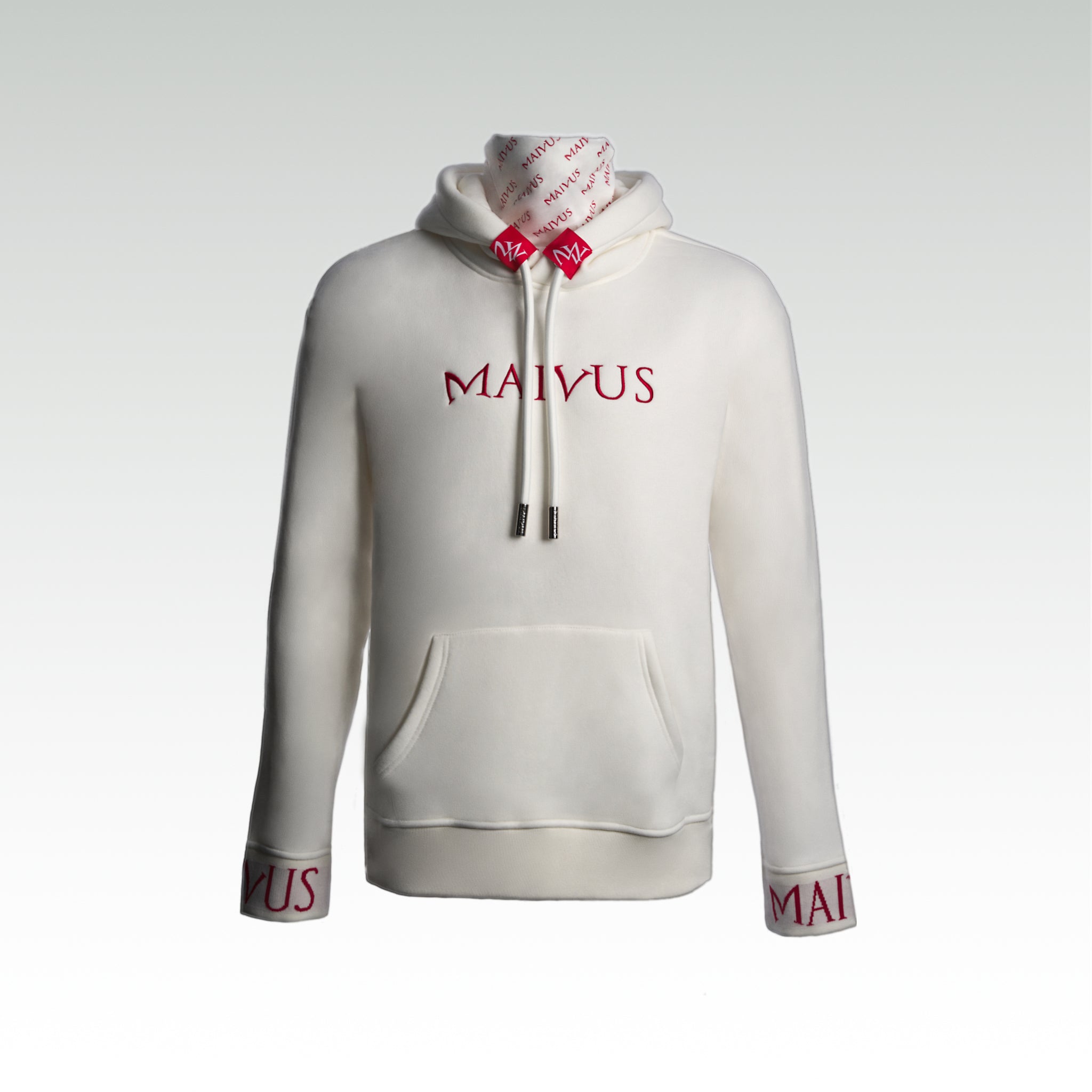 Close up of a luxury white and red hoodie with red embroidery, branded snood, large drawstrings, and branded cuffs from 'MAIVUS' against a white studio