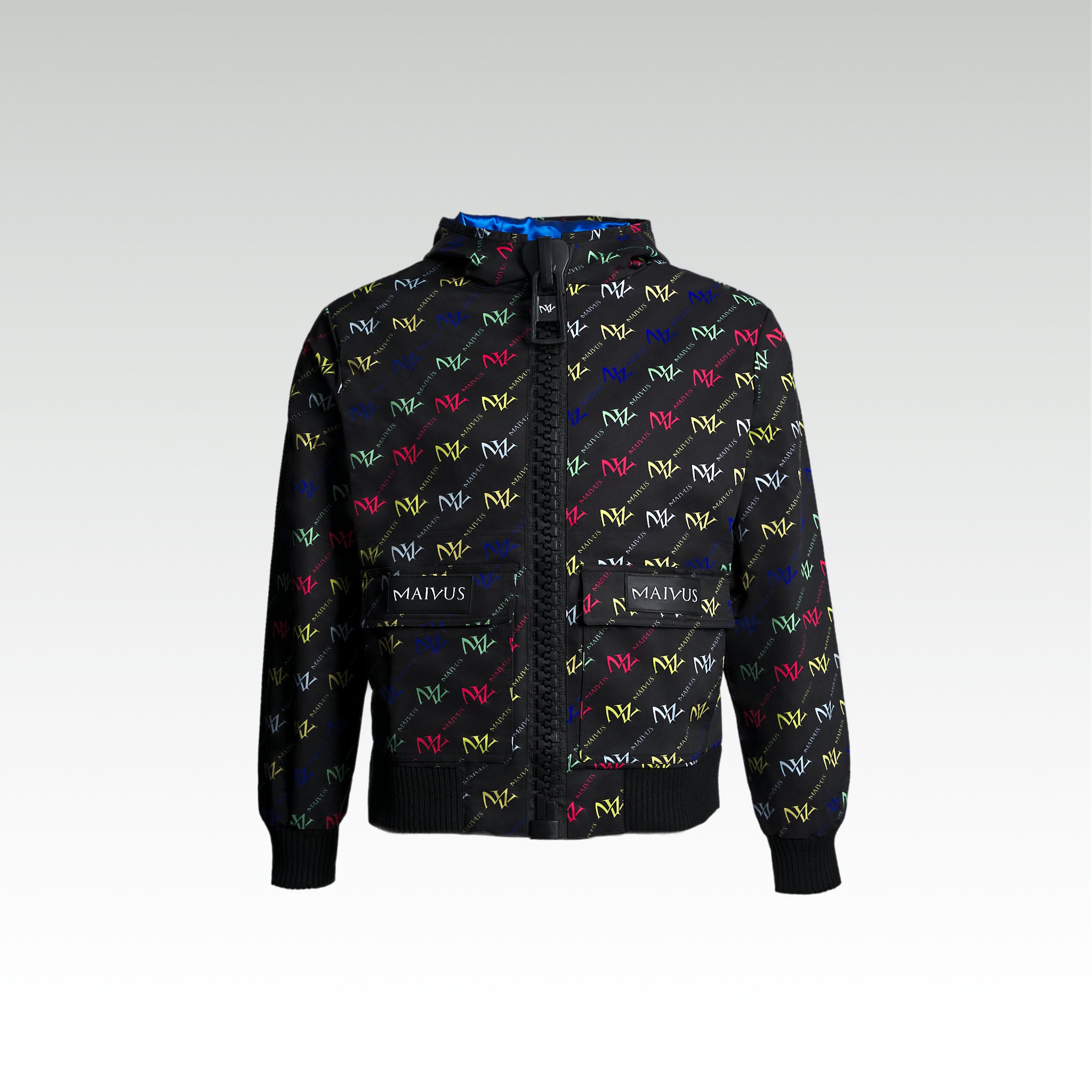 Close up of the luxury multicolored jacket with 'MV' branding from 'MAIVUS' against a white studio backdrop