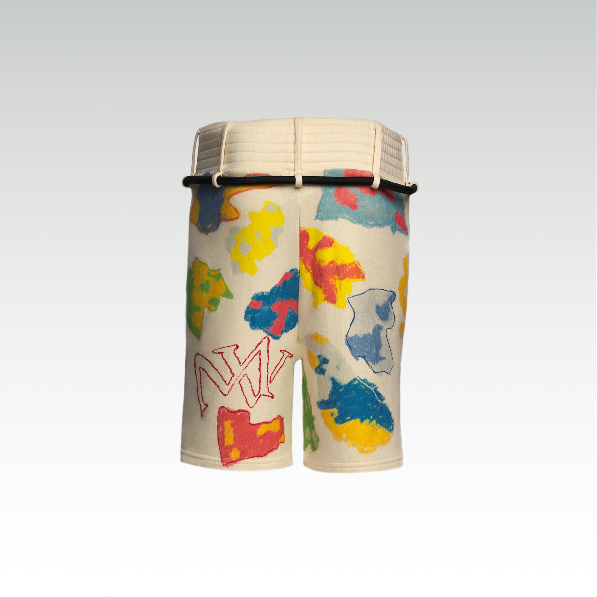 Close up of the luxury multicolored shorts with abstract shapes and 'MAIVUS' branding from 'MAIVUS' against a white studio backdrop