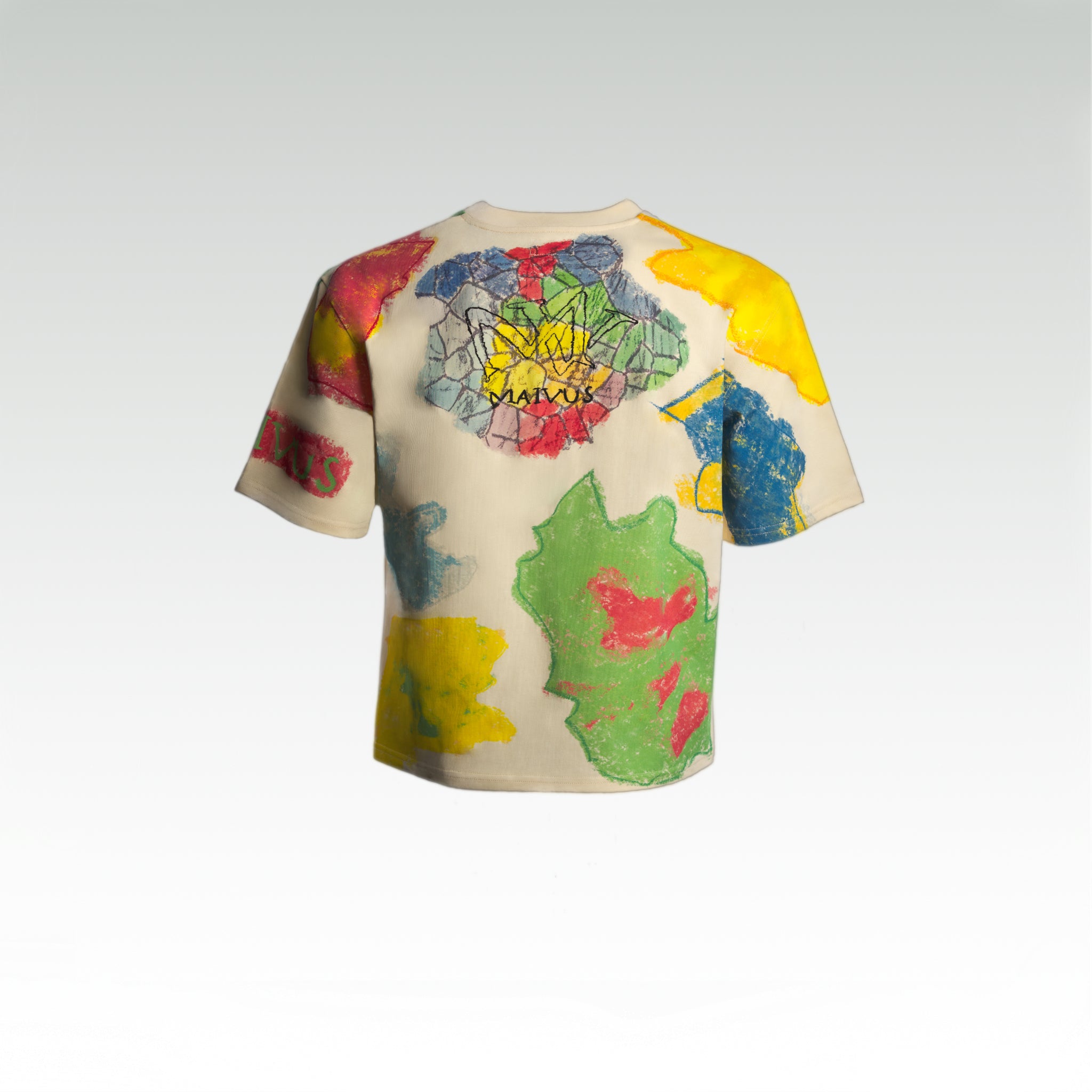 Close up of the luxury multicolored t-shirt with abstract shapes and 'MAIVUS' branding from 'MAIVUS' against a white studio backdrop