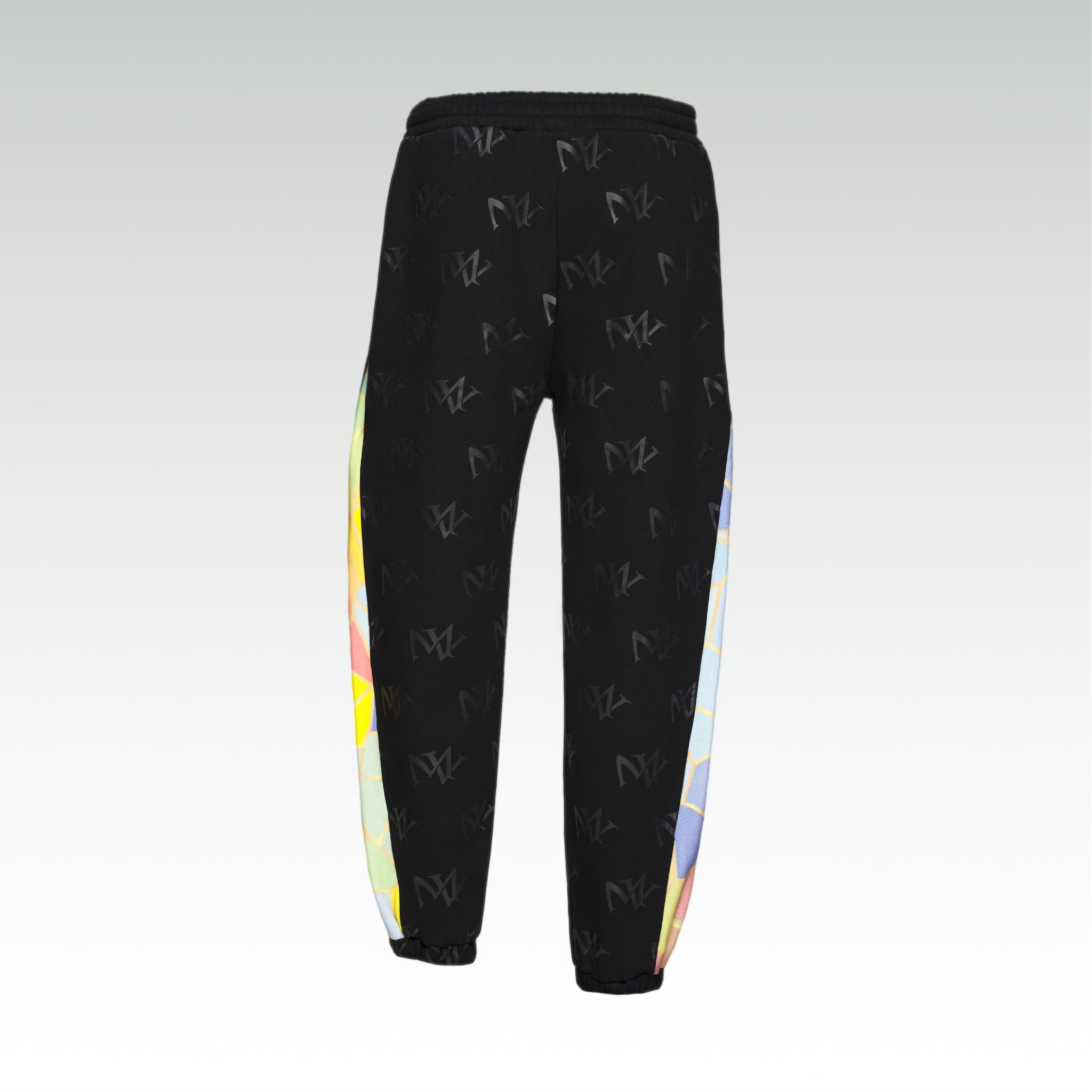 Close up of  the luxury multicolored  joggers with 'MV' branding and geometric shapes from 'MAIVUS' against a white studio backdrop
