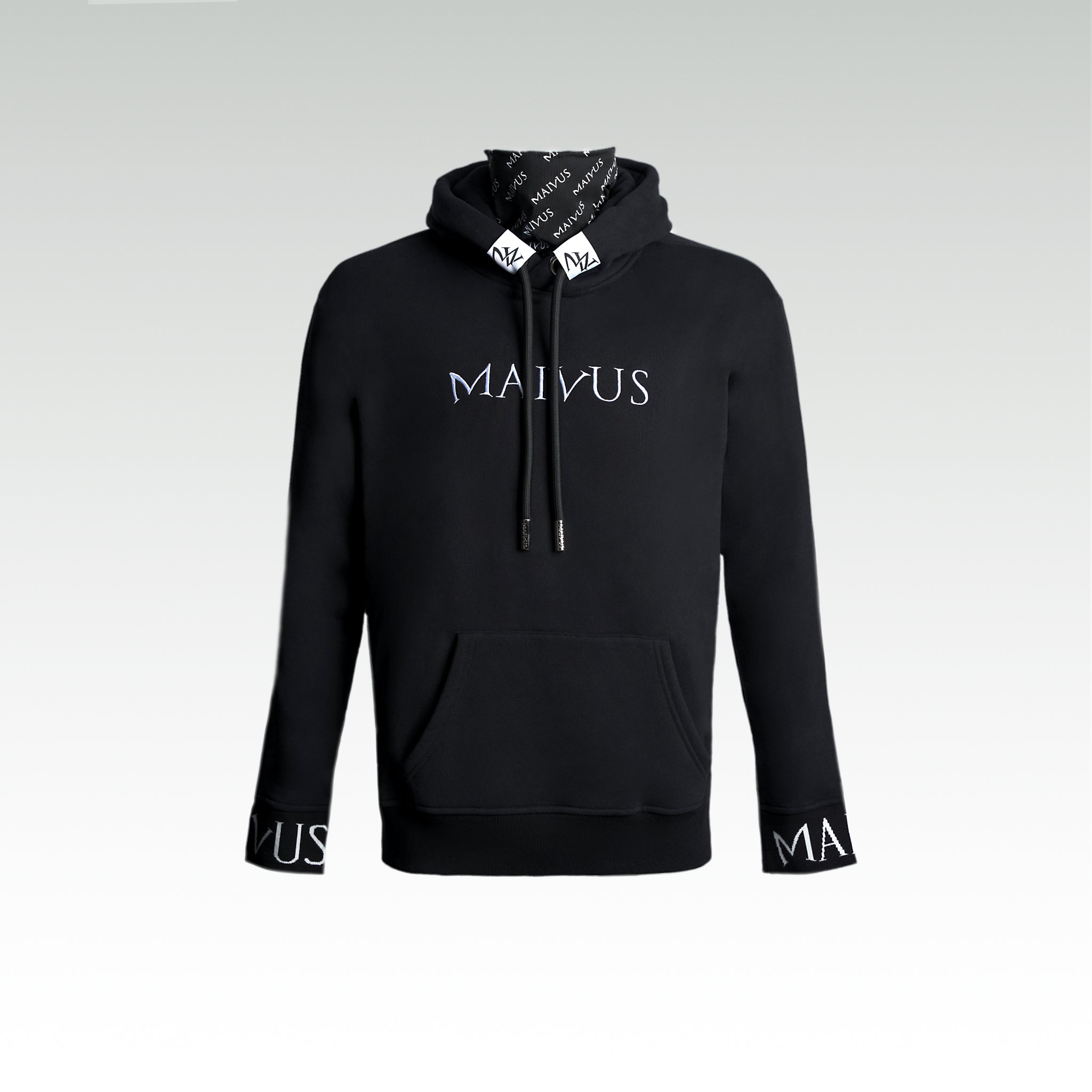 Close up of  a luxury black and white hoodie with white embroidery, branded snood, large drawstrings, and branded cuffs from 'MAIVUS' against a white studio 