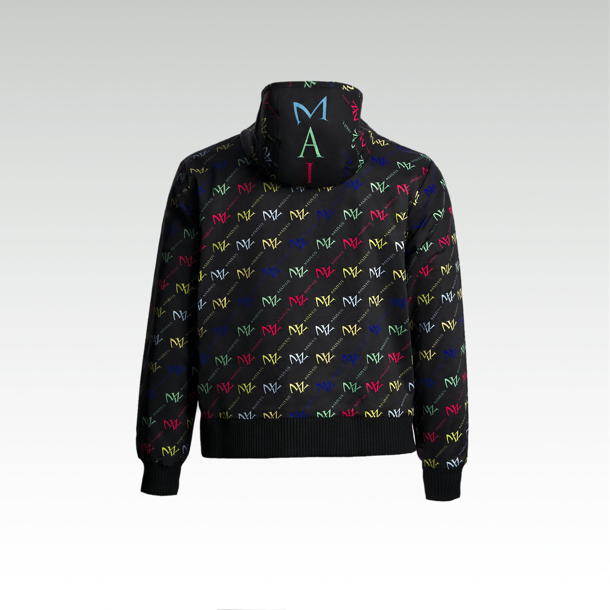 Close up of the luxury multicolored jacket with 'MV' branding from 'MAIVUS' against a white studio backdrop