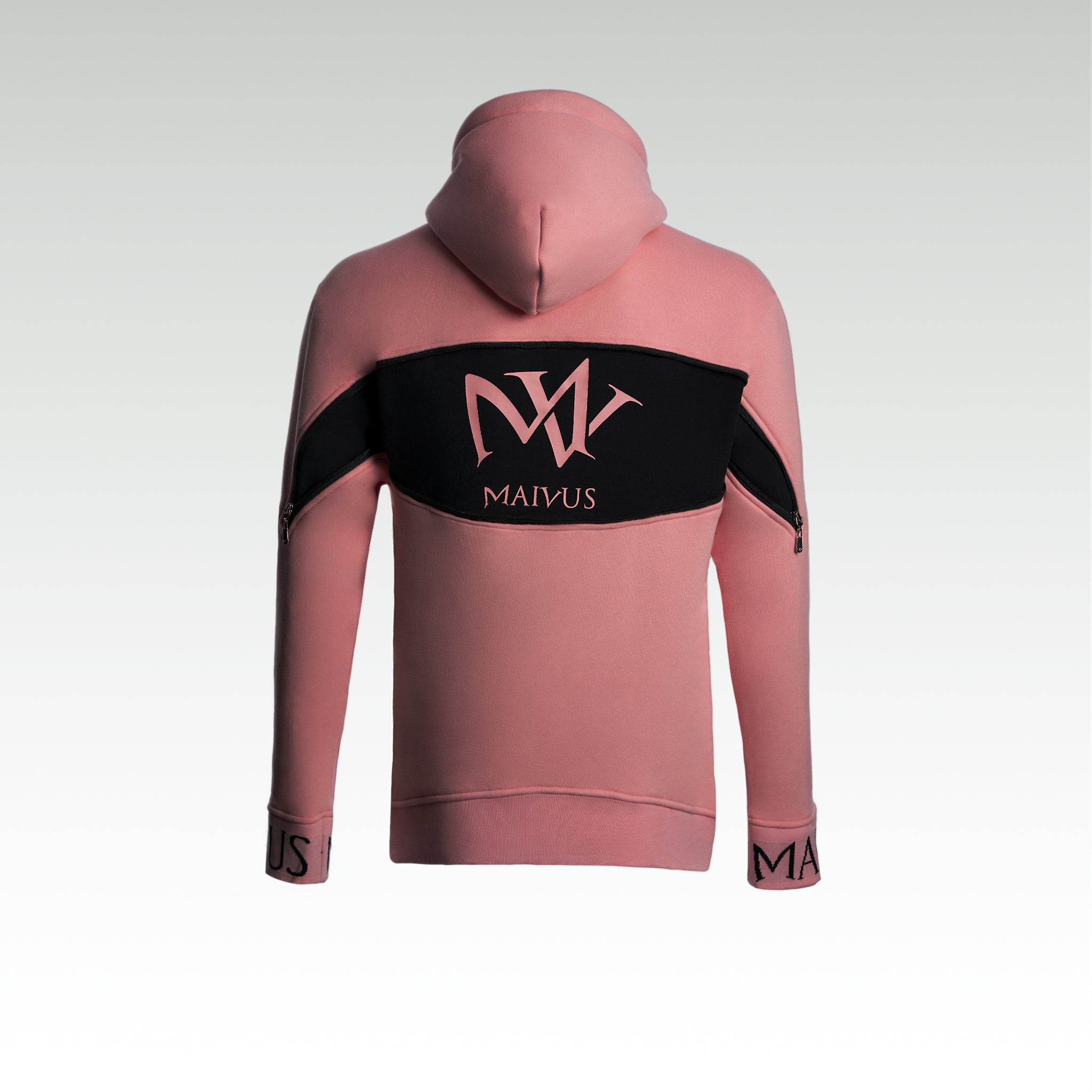 Close up of a pink and black luxury hoodie. Large 'MV' logo on back of hoodie from 'MAIVUS' against a white studio backdrop