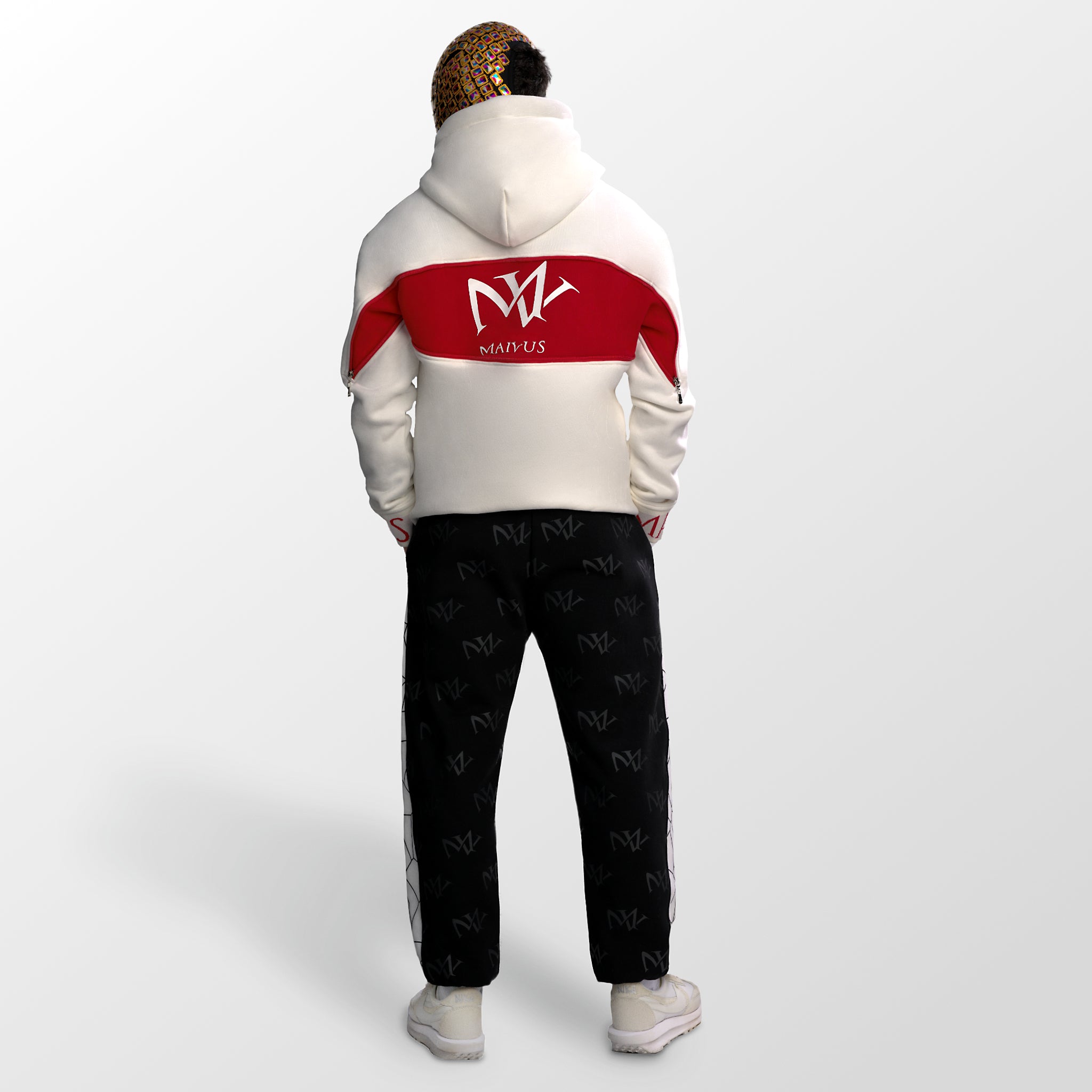 Model wearing a white and red luxury hoodie and black and white joggers. 'MV' branding all over the joggers and large 'MV' logo on back of hoodie from 'MAIVUS' against a white studio backdrop
